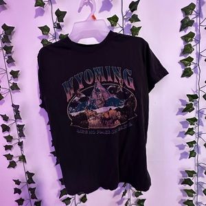 Dark grey t shirt size small medium.